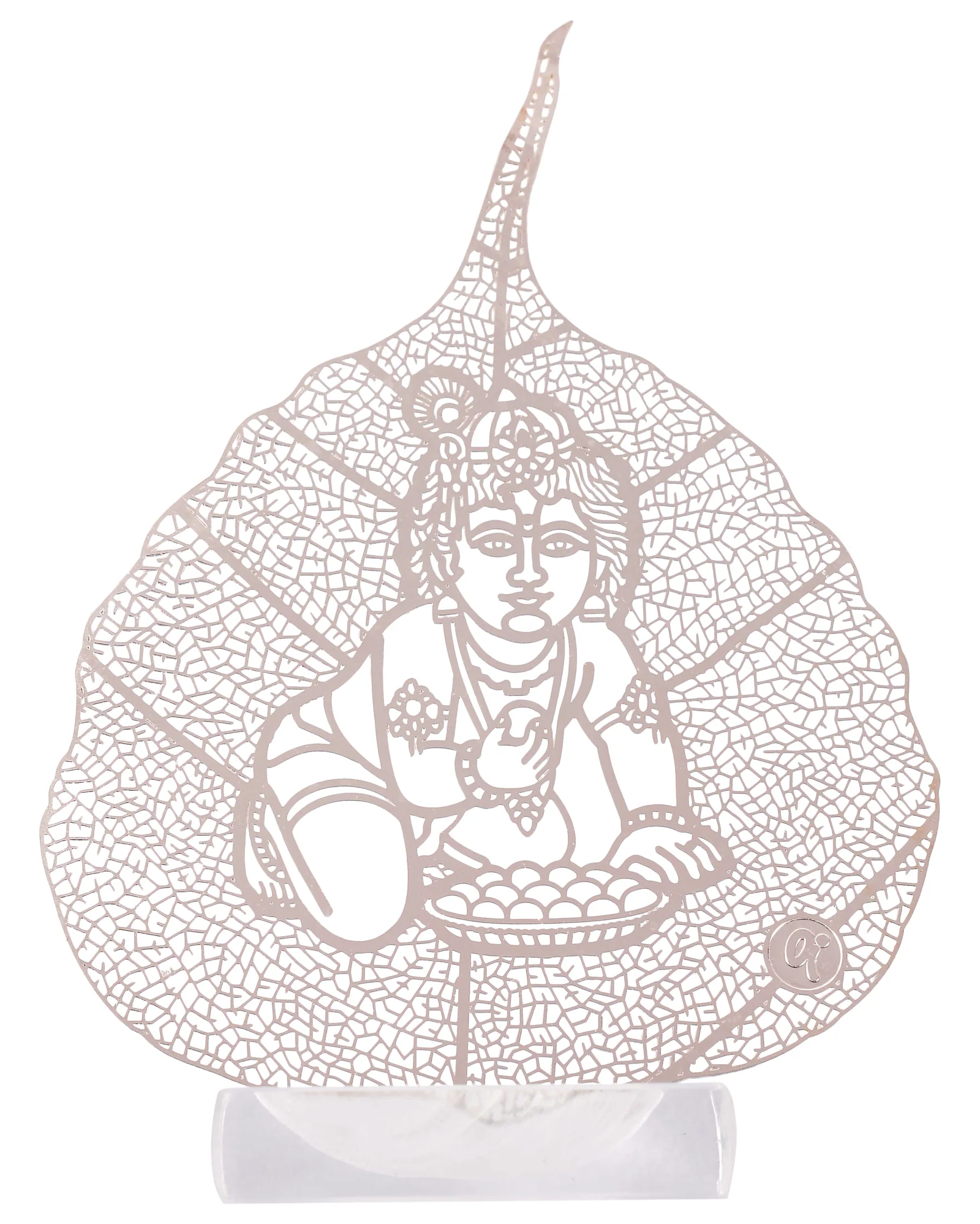 Silver skeletonised peepal leaf engraved with the infant Krishna crawling with a handful of butter, standing in a clear acrylic pedestal