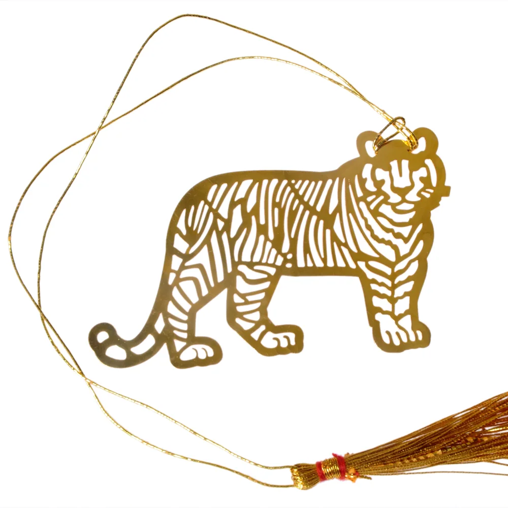 Die-cut gold-tone bookmark of a walking tiger with its stripes cut right through the sheet, on a gold cord with a tassel
