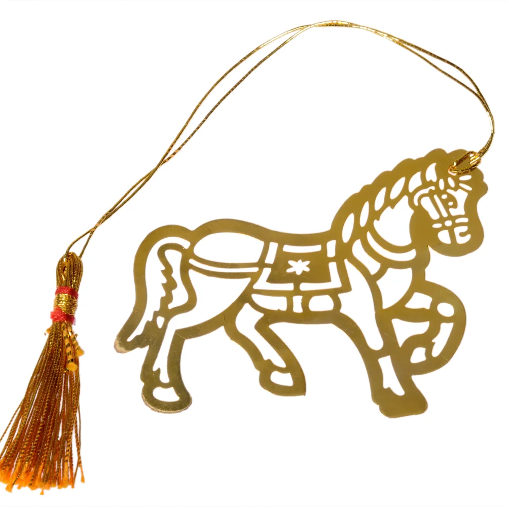 Die-cut gold-tone bookmark of a horse in a decorated saddle and bridle with a plaited mane, on a gold cord with a tassel
