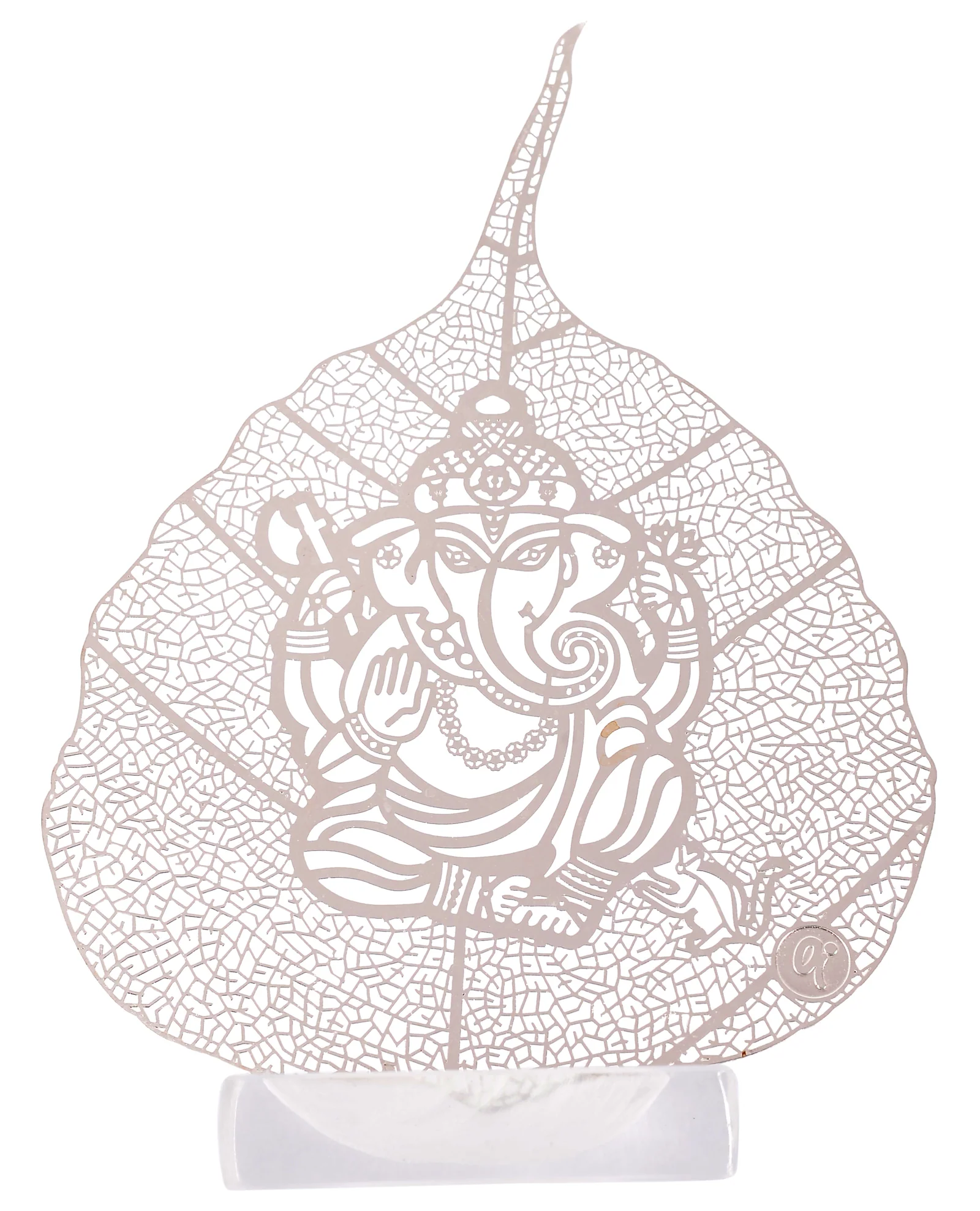 Silver skeletonised peepal leaf engraved with Ganesha seated on a lotus with his mouse below, standing in a clear acrylic pedestal