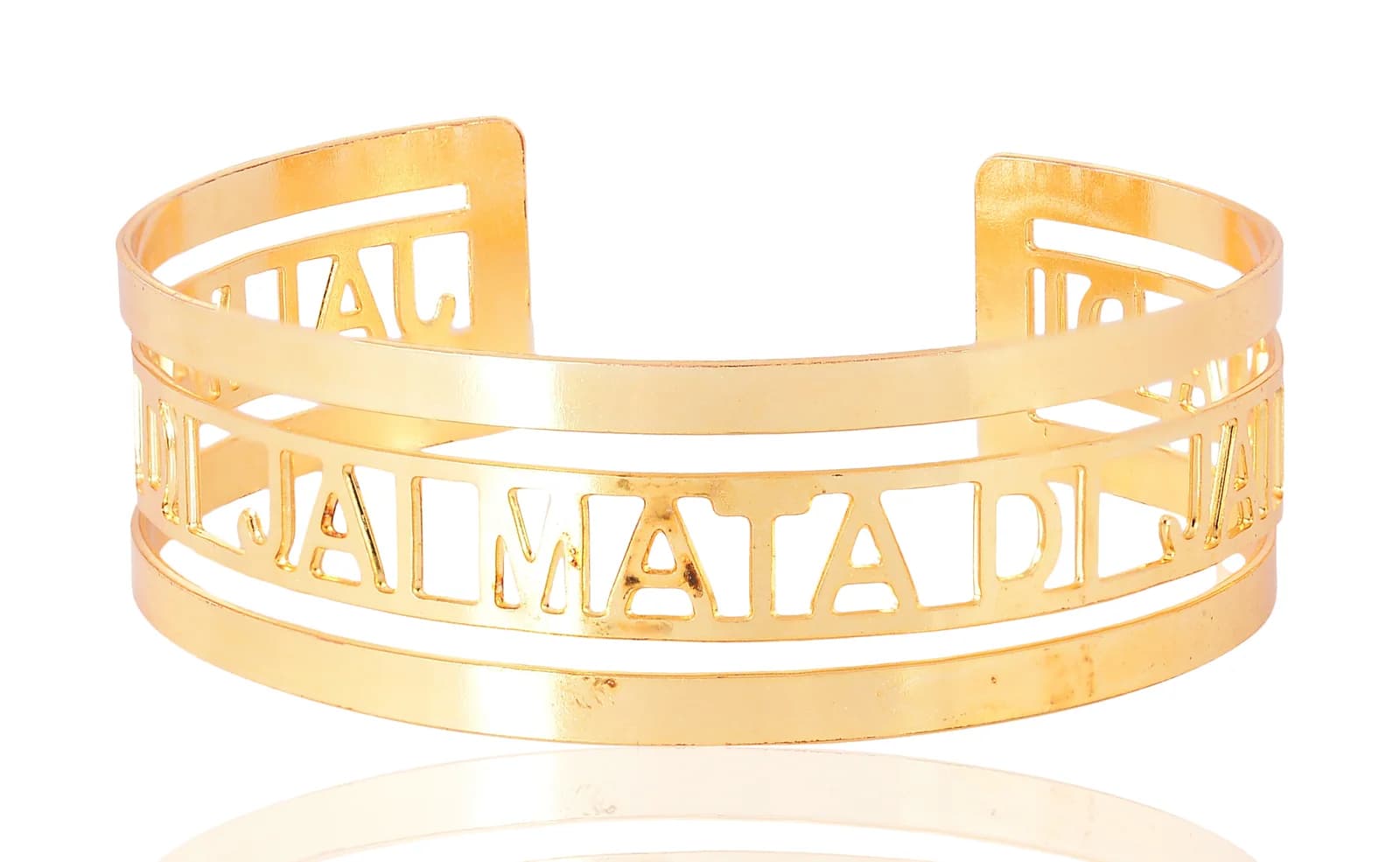 Open gold-plated cuff bangle pierced with JAI MATA DI in Roman capitals, shot square on at eye level so the mantra reads straight across the front band