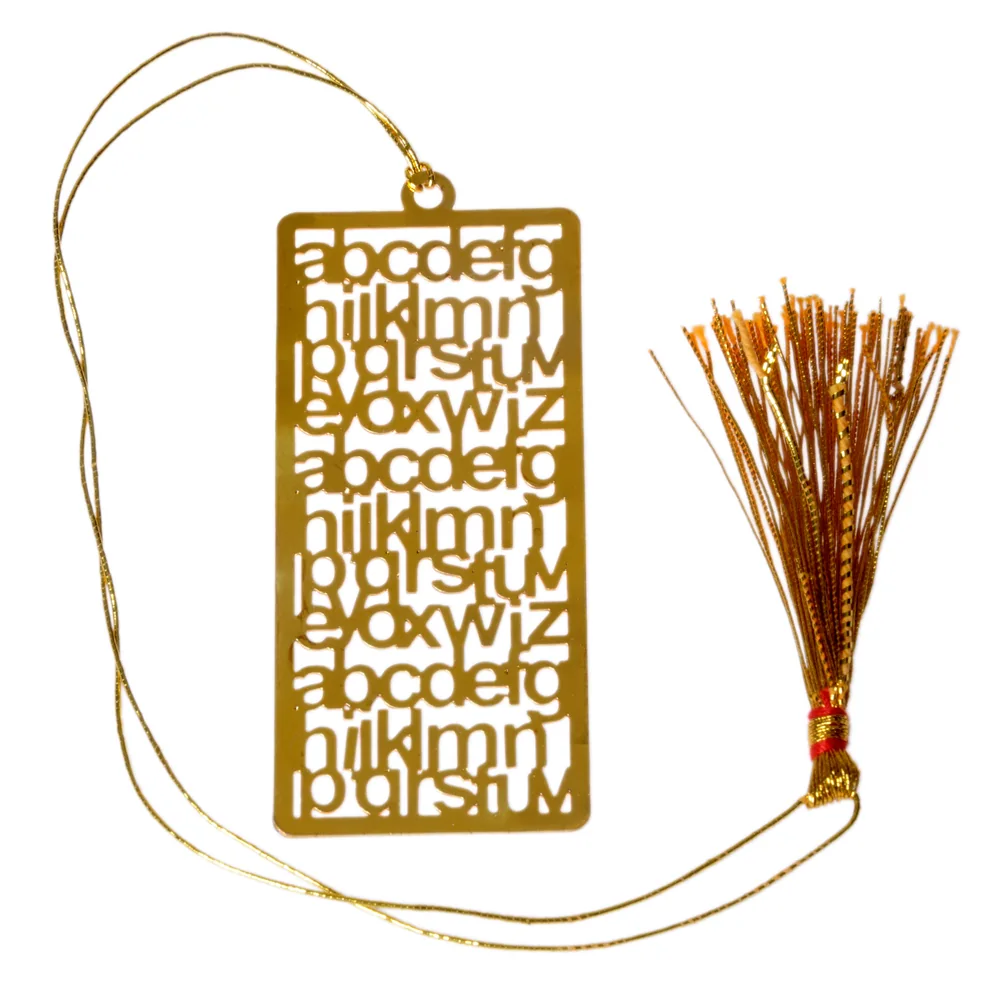 Die-cut gold-tone bookmark of the lowercase alphabet cut in rows and repeated down the plate, on a gold cord with a tassel