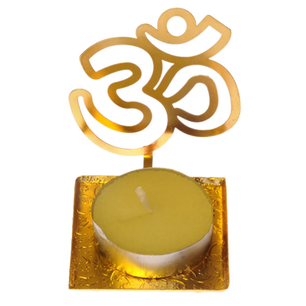 Pierced gold-tone tealight holder cut as a single raised Om, on a small square tray