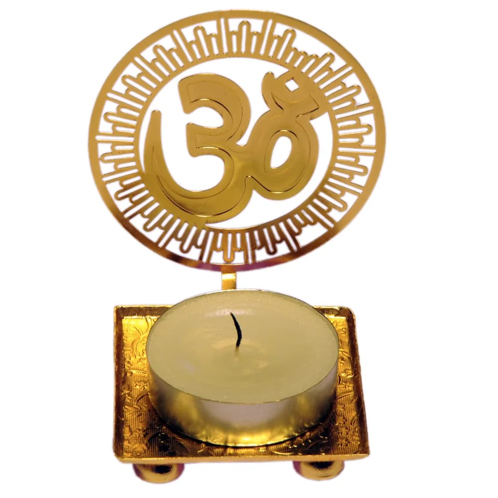 Pierced gold-tone tealight holder cut as an Om inside a ring of radiating sun bars, on a square tray