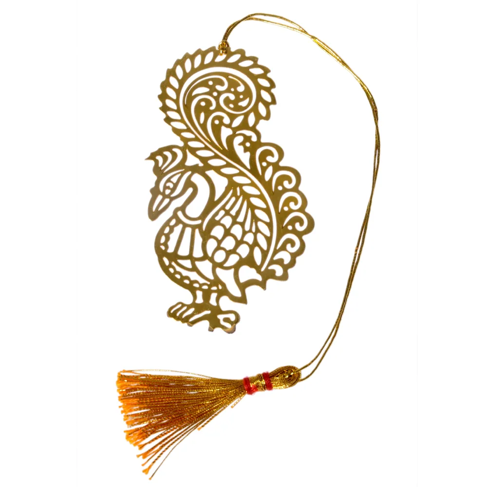 Die-cut gold-tone bookmark of a peacock in folk-art style, its plume curling over its back in dense scrollwork, on a gold cord with a tassel