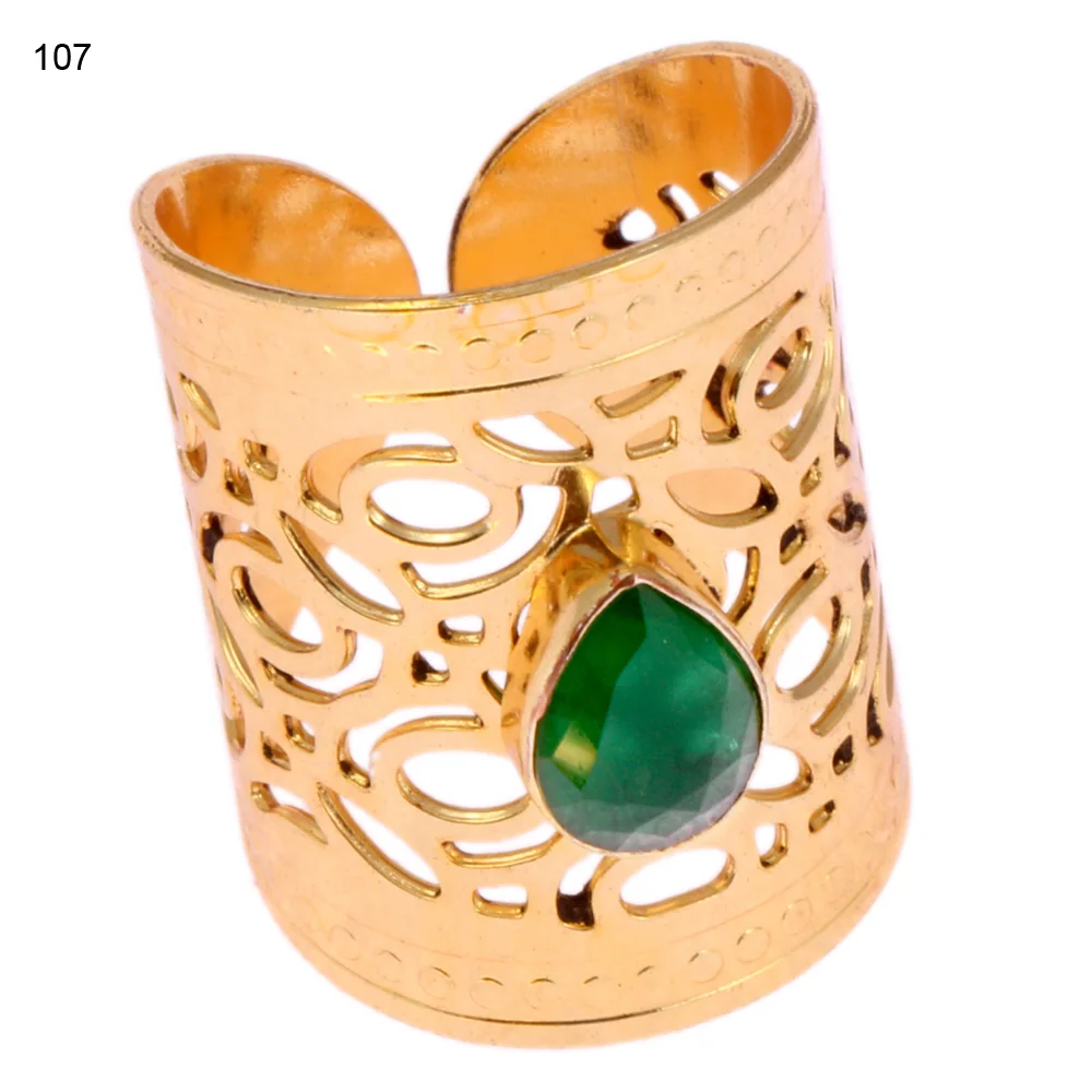 Gold-plated brass adjustable ring with a curling paisley scroll openwork band and a single bezel-set faceted green stone
