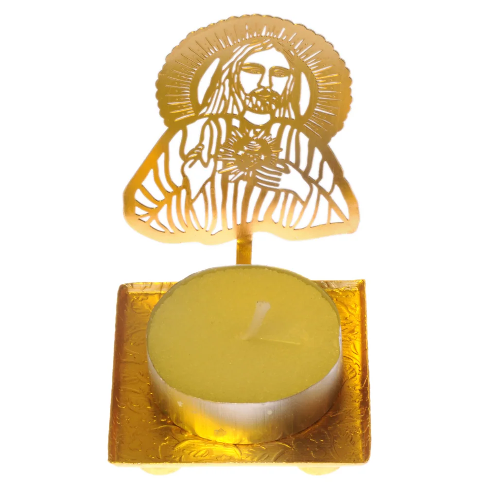 Pierced gold-tone tealight holder cut as the Sacred Heart of Jesus, one hand raised and a rayed halo behind, on a square tray