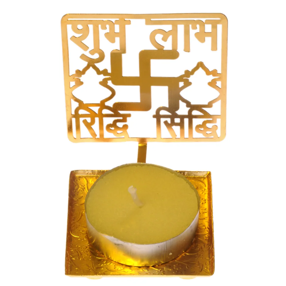 Pierced gold-tone tealight holder cut as a panel reading शुभ लाभ in Devanagari over a swastika and a pair of kalash, on a square tray