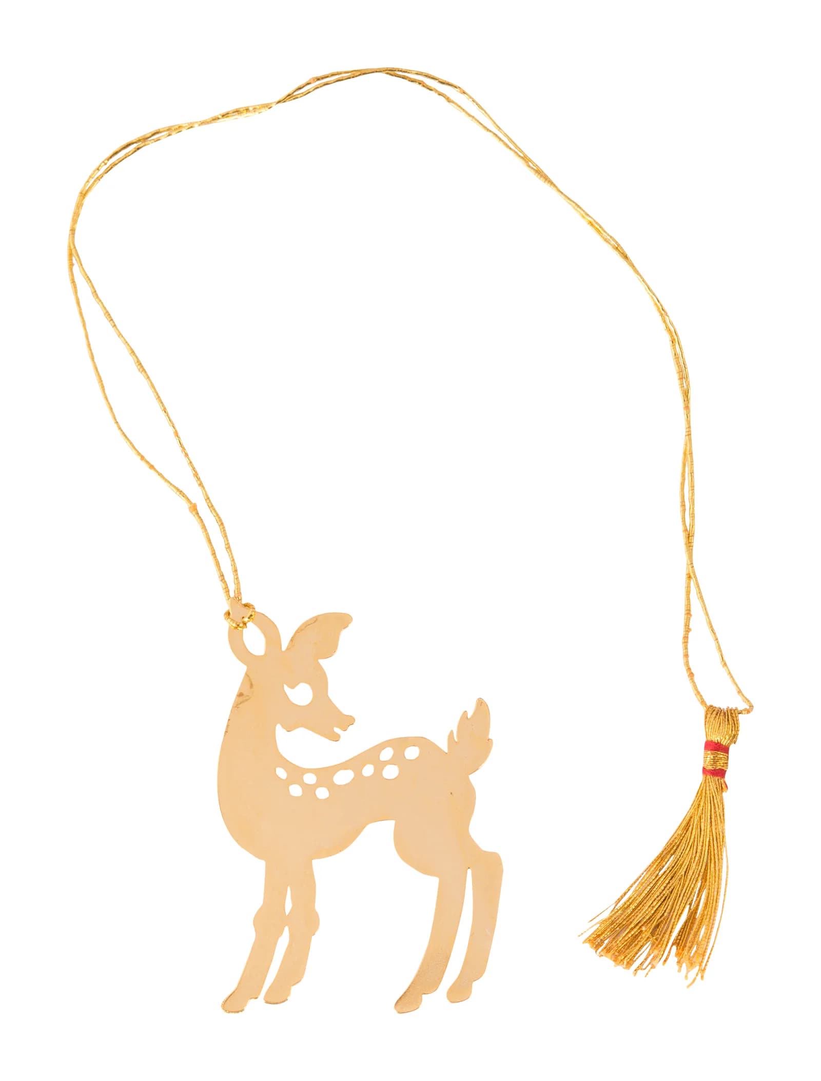 Die-cut gold bookmark of a standing fawn with pierced spots along its flank, laid out with its gold cord and tassel