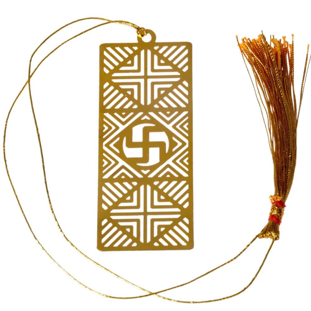 Die-cut gold-tone bookmark of a swastika set in a rangoli grid of chevrons and cross motifs on a tall rectangle, on a gold cord with a tassel