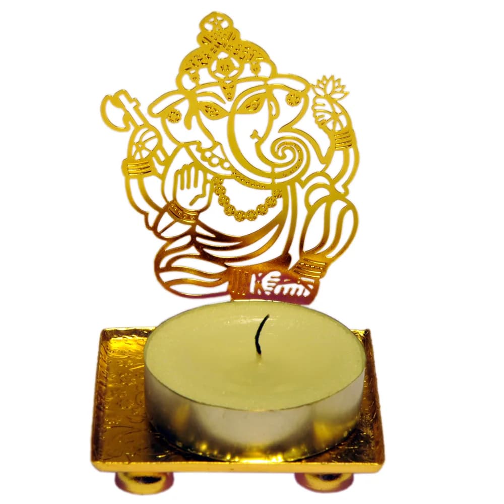 Pierced gold-tone tealight holder cut as Ganesha seated under a crowned arch holding a modak, standing on a small square tray