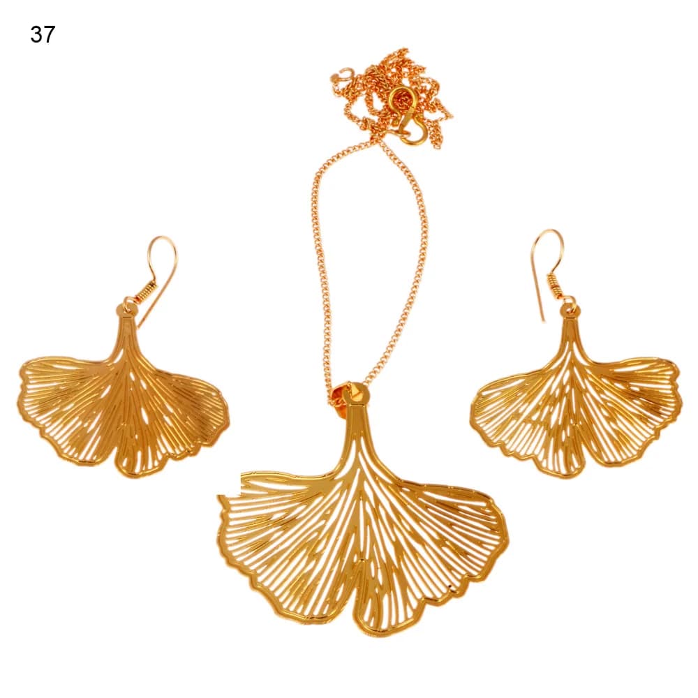 Gold-plated three-piece set with a ginkgo leaf pendant and matching hook earrings, the fan opened into fine ribs that radiate out to a notched hem
