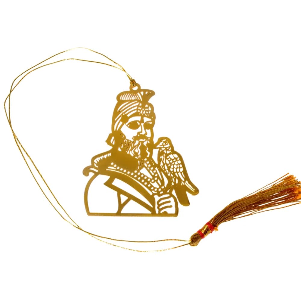 Die-cut gold-tone bookmark of Guru Gobind Singh Ji in a plumed turban with a hawk perched on his hand, on a gold cord with a tassel