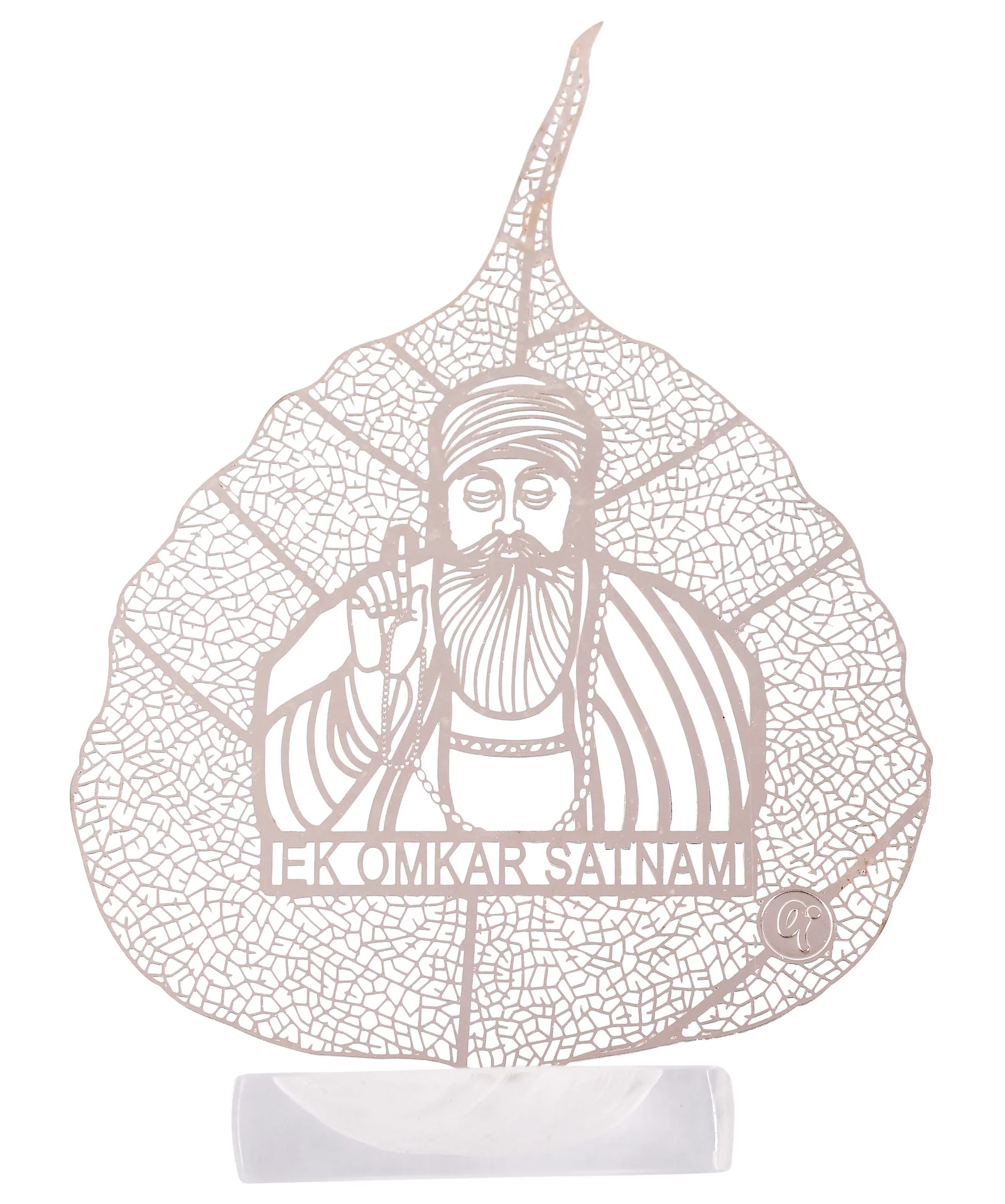 Silver skeletonised peepal leaf engraved with Guru Nanak Dev Ji, the Ek Onkar Satnam inscription beneath him, in a clear acrylic pedestal
