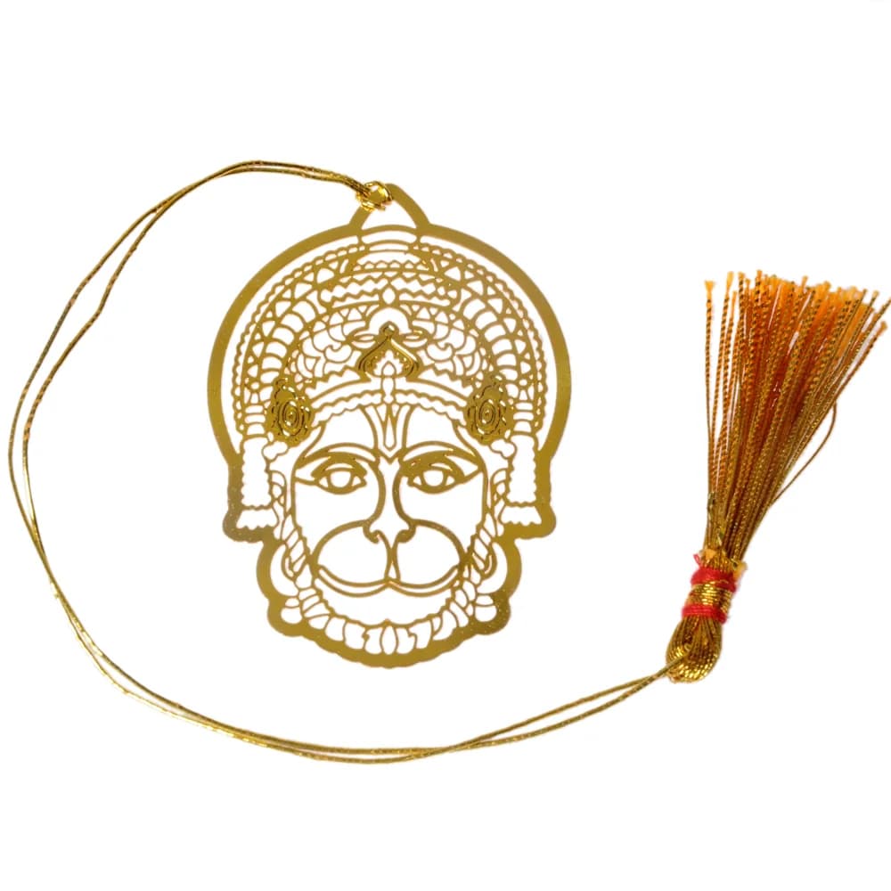 Die-cut gold-tone bookmark of Hanuman's face alone under a filigree crown and lace mane, on a gold cord with a tassel