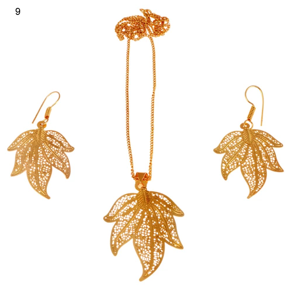 Gold-plated three-piece set with a five-lobed maple leaf pendant and matching hook earrings, every lobe filled to its point with open lace filigree