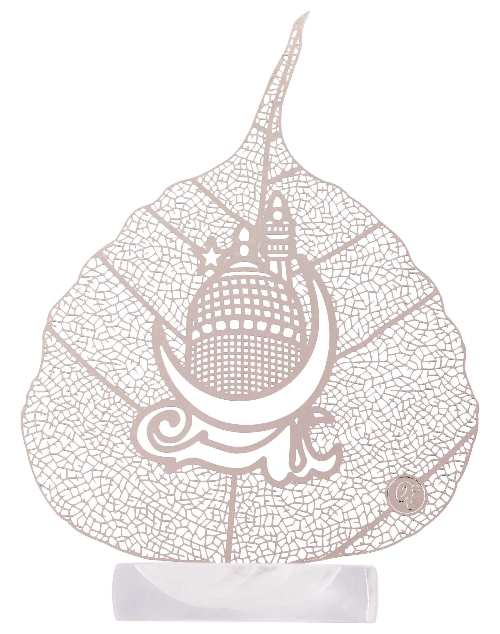 Silver skeletonised peepal leaf engraved with a domed mosque and minarets beneath a crescent moon, Arabic calligraphy above, in a clear acrylic pedestal