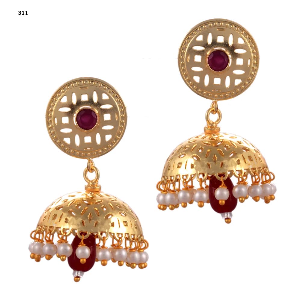 A pair of gold-plated jhumka earrings — a pierced disc stud set with a red stone above a single perforated dome, pearl-fringed, with a red glass teardrop hanging at the centre