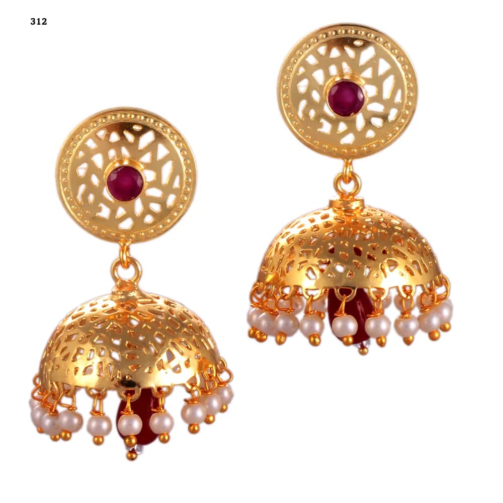 A pair of gold-plated jhumka earrings — a pierced disc stud set with a red stone above a single deep perforated dome, pearl-fringed, with a red glass teardrop hanging at the centre