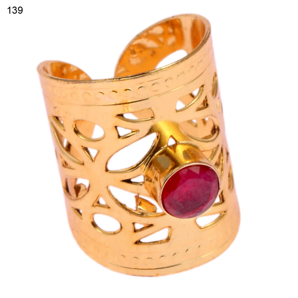Gold-plated brass adjustable ring with a irregular pebble openwork band and a single bezel-set faceted red stone