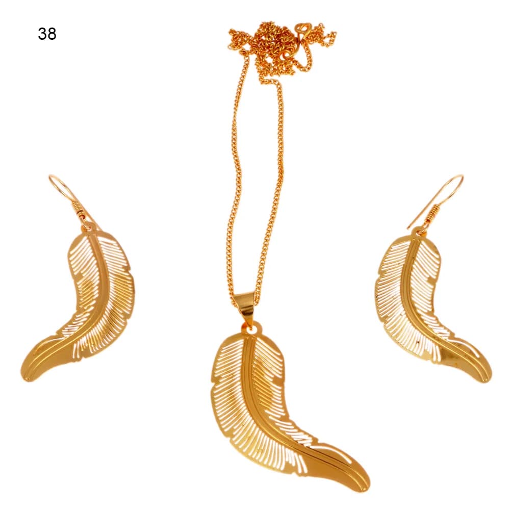 Gold-plated three-piece set with a curved quill feather pendant and matching hook earrings, the barbs cut as fine slits either side of a solid shaft