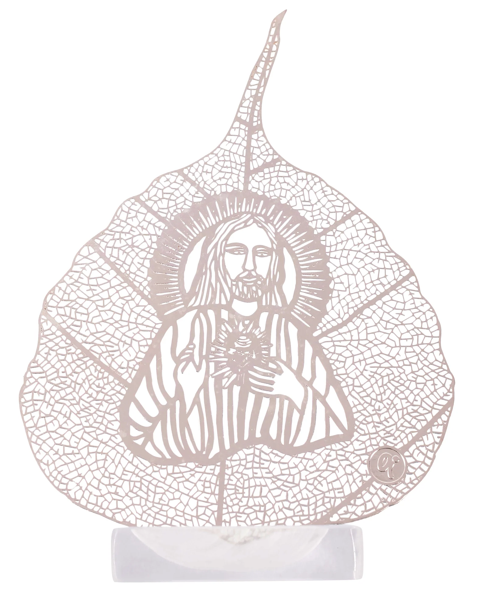 Silver skeletonised peepal leaf engraved with the Sacred Heart of Jesus, one hand raised in blessing, in a clear acrylic pedestal