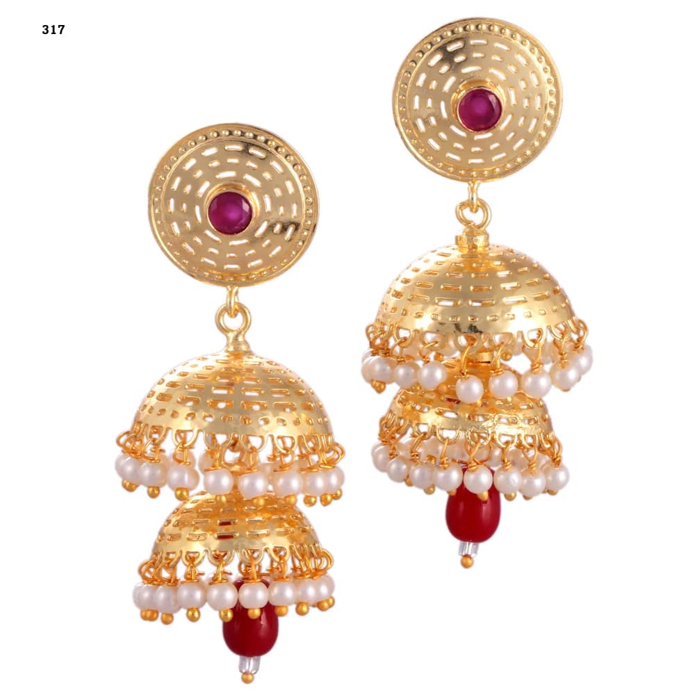 A pair of gold-plated jhumka earrings — a pierced disc stud set with a red stone above two stacked perforated domes, both pearl-fringed, with a red glass teardrop at the centre