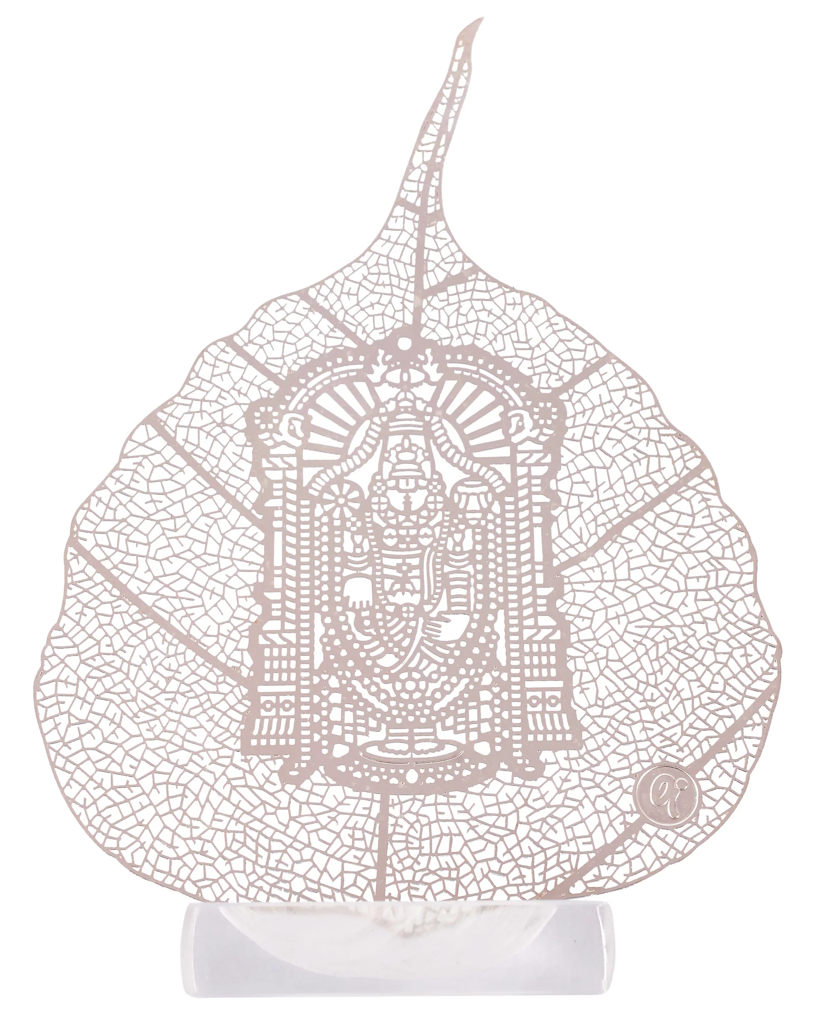 Silver skeletonised peepal leaf engraved with Tirupati Balaji standing crowned with a beaded garland, in a clear acrylic pedestal