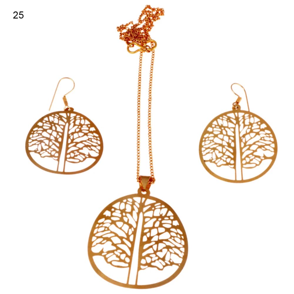 Gold-plated three-piece set with a round disc pendant and matching hook earrings, holding a broad tree on a straight trunk with its foliage cut as crazed net